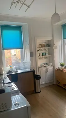 a kitchen with a sink and a window at The Port in Port Bannatyne