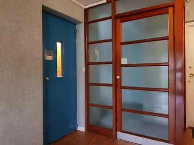 a door to a room with a blue door at Edinburgh Family-Friendly Flat Walkable from Princess street in Edinburgh