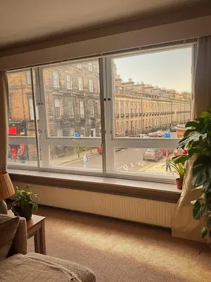 a large window with a view of a street at Duplex - City Centre 4-Bed Retreat in Edinburgh