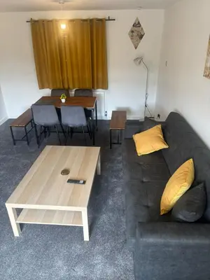 a living room with a couch and a coffee table at NEW - 3 Bedroom House in East Kilbride in East Kilbride