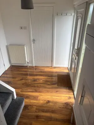 an empty room with a wooden floor and a door at NEW - 3 Bedroom House in East Kilbride in East Kilbride