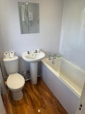 a bathroom with a toilet and a sink and a tub at NEW - 3 Bedroom House in East Kilbride in East Kilbride