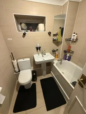 a bathroom with a toilet and a sink and a tub at Traveler Nest in Moffat