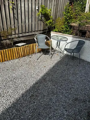 two chairs and a table on a patio at The West Wing - 1Bedroom Annexe with parking in Oban