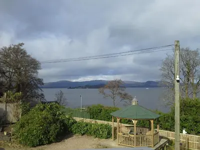 a gazebo with a view of the water at Bruach Lodge in Balloch