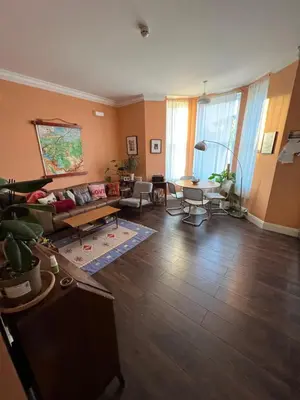 a living room with a couch and a table at Seven Sisters 1 bed apartment in Moffat