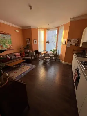a living room with a couch and a table at Seven Sisters 1 bed apartment in Moffat