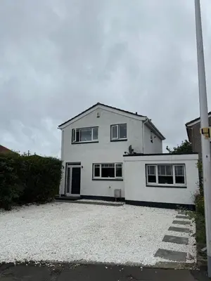 a white house with a driveway in front of it at Best stay in the bay in Saint Davids