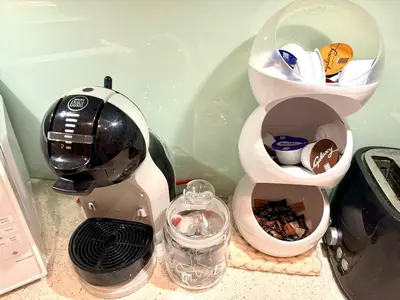 a kitchen counter with a coffee maker and a blender at Private 1 bed flat Knightsbridge, Chelsea in Moffat