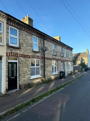 a brick building on the side of a street at Station House in Moffat