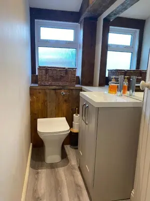 a bathroom with a toilet and a sink at Fernbank Cottage - Bruichladdich, Isle of Islay in Bruichladdich