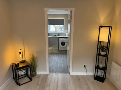a living room with a sink and a washing machine at Newly Renovated Flat Edinburgh - 2 x Double Beds in Edinburgh