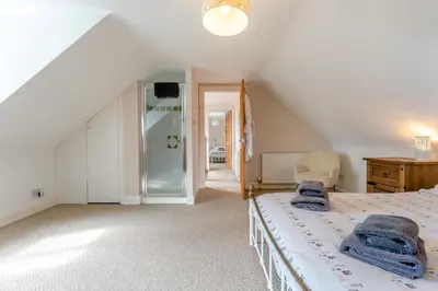 a bedroom with a bed with blue towels on it at 2 Bed in Methven oc-c32362 in Methven