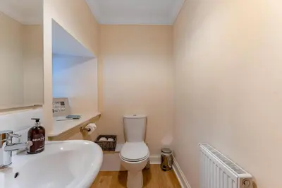 a bathroom with a white toilet and a sink at 2 Bed in Methven oc-c32362 in Methven