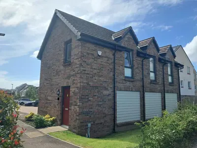 a brick house with a garage at Detached Home in Bishopton in Bishopton