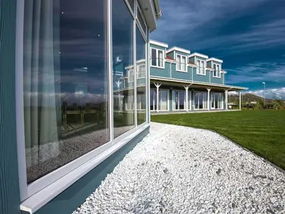 a building with large windows on the side of it at The Waterside Hotel & Spa in Seamill