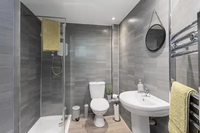 a bathroom with a toilet and a sink and a shower at Sleek Canalside Stay in Edinburgh in Edinburgh