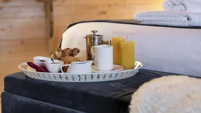 a tray of food and drinks on a table at Carnethy Cabin in Kirknewton