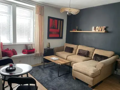 a living room with a couch and a table at Foundry Street Apartment 1 - Dunfermline City Centre in Dunfermline