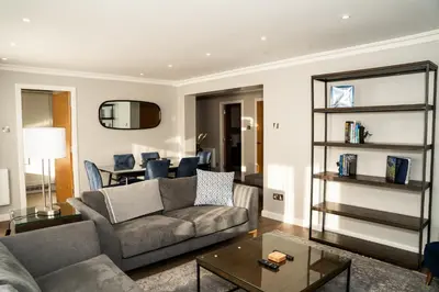a living room with a couch and a table at 28 Guthrie Court - Gleneagles Village