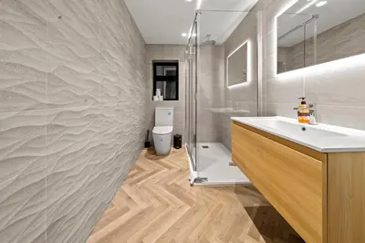 a bathroom with a sink and a shower and a toilet at The Salt Room Modern 1 Bedroom Home By AltoLuxo Short Lets Serviced Accommodation With Free Wifi & Parking in Moffat