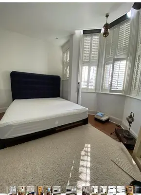 a bedroom with a bed in a room with windows at 600sf 1 bedroom apartment in Moffat