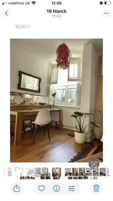 a living room with a desk and a table with a chair at 600sf 1 bedroom apartment in Moffat