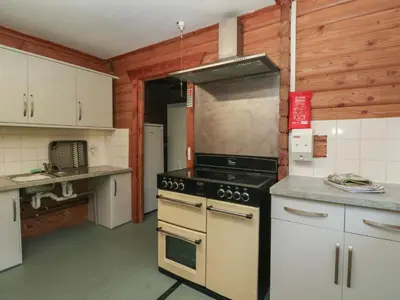 a kitchen with a stove top oven in a kitchen at Shore Lodge Brodick Castle in Brodick
