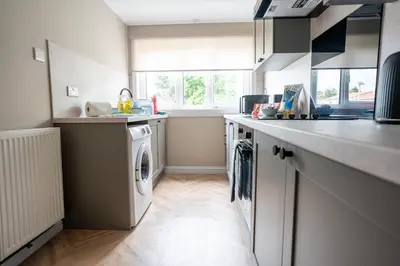 a kitchen with a washer and dryer at Rise House in Livingston