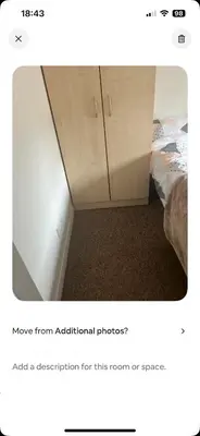 a bedroom with a bed and a cupboard at Serenity Space in Glasgow