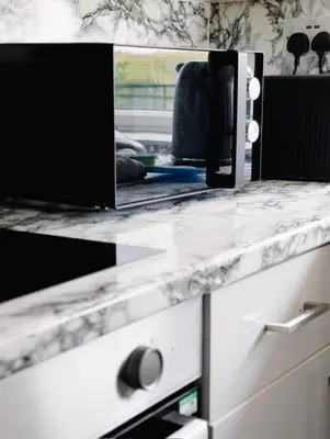 a white counter top with a mirror above a drawer at 3 BDR House By Caledonia Luxe Stays Short Lets & Serviced Accommodation West Calder in West Calder