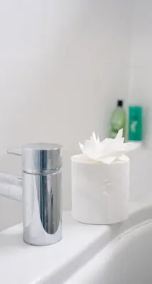 a container of paper towels sitting on a sink at 3 BDR House By Caledonia Luxe Stays Short Lets & Serviced Accommodation West Calder in West Calder