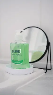 a bottle of green moisturizing moisturizing moisturizing brush on a table at 3 BDR House By Caledonia Luxe Stays Short Lets & Serviced Accommodation West Calder in West Calder