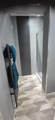 a room with a mirror and a chair in a room at 46 High Street in Campbeltown