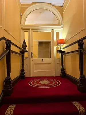 a hallway with a red carpet and a door at Entire rental in Edinburgh City Centre in Edinburgh
