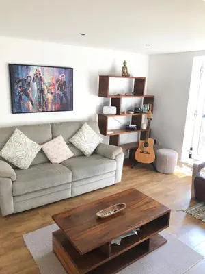 a living room with a couch and a coffee table at 17 flat 11 slateford gait in Edinburgh