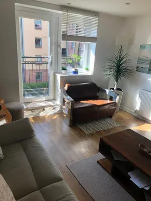 a living room with a couch and a table at 17 flat 11 slateford gait in Edinburgh