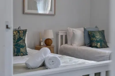 a living room with a bed and a couch at Riverside City Apartment in Glasgow