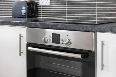 a black and silver oven in a kitchen at The Portland Penthouse - Donnini Apartments in Troon