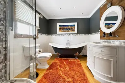 a bathroom with a tub and a toilet and a sink at The Allanbreck Studio Glencoe Ballachulish Highlands Near Fortwilliam in Glencoe