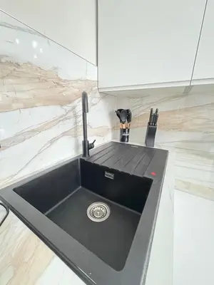 a black sink in a kitchen with a counter at 3BR West End Flat w Free Parkin in Glasgow