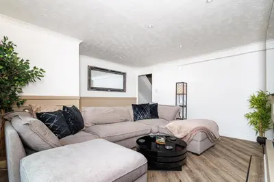 a living room with a couch and a table at 2 Bedroom House-Free Parking in Rosyth