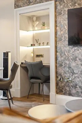 a room with a table and two chairs and a desk at Prime Central Edinburgh 1 bed in Edinburgh