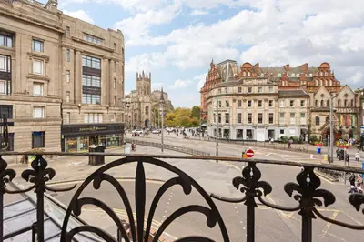 a view from a balcony of a city with buildings at Prime Central Edinburgh 1 bed in Edinburgh