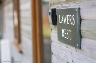 a sign on a building that reads interns rest at Ben Lawers Rest Cabin - Hot Tub and Loch Tay Vistas in Lawers