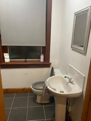 a bathroom with a toilet and a sink at Quirky Cottage Central Bathgate in Bathgate