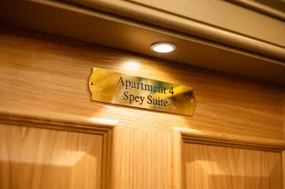 a sign on a door that says apartment spy suite at Prime Central Edinburgh 2 bed in Edinburgh