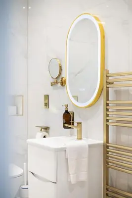 a white bathroom with a sink and a mirror at Prime Central Edinburgh 2 bed in Edinburgh