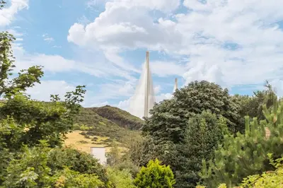 a view of the washington monument through the trees at Stylish Stay in Inverkeithing. in Fife