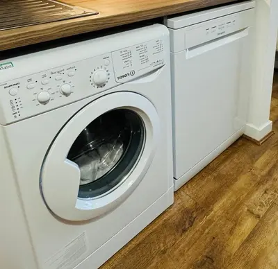 a white washer and dryer in a kitchen at City Central Stay in Glasgow